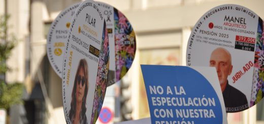 Round protest posters with images of people and political messages, carried on sticks during a demonstration about pensions and pensions reform in a city street.